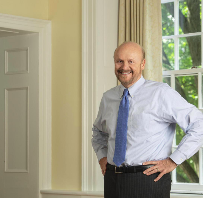 Chancellor Christopher J. Molloy standing in front of window