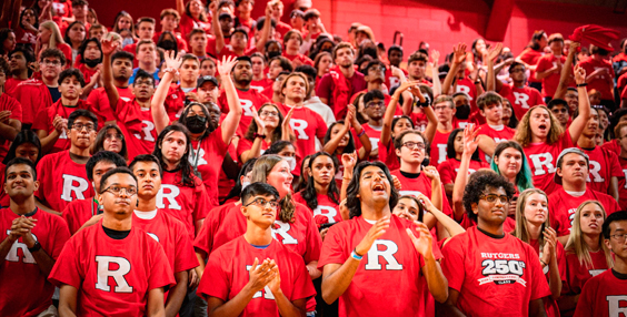 Photo of a crowd of Rutgers students cheering.